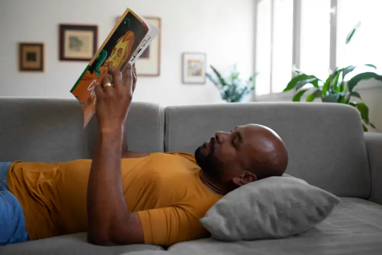 Medium Shot Man Reading Comics Home 768x513