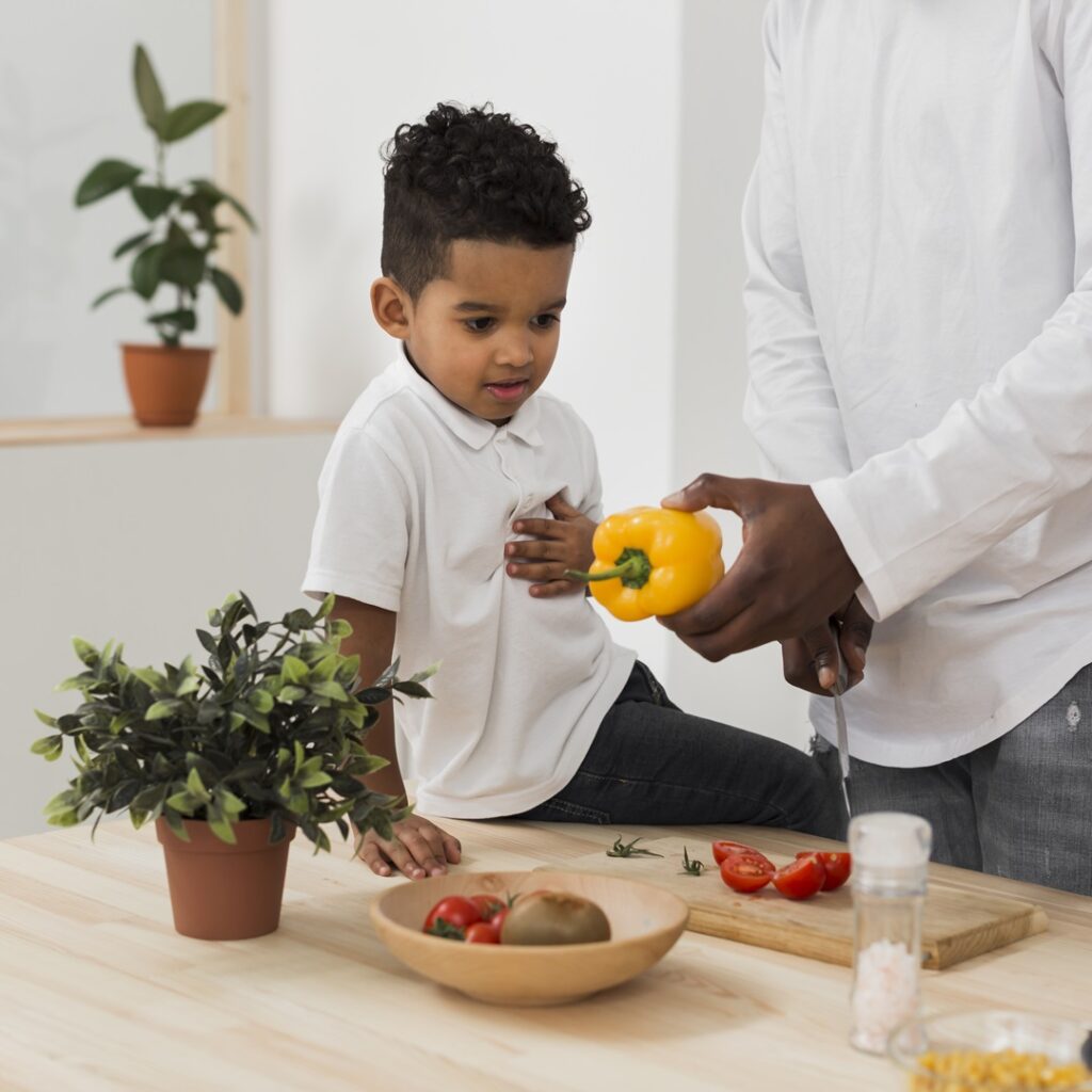 The Importance of Reasonable Adjustments son looking his father making dinner